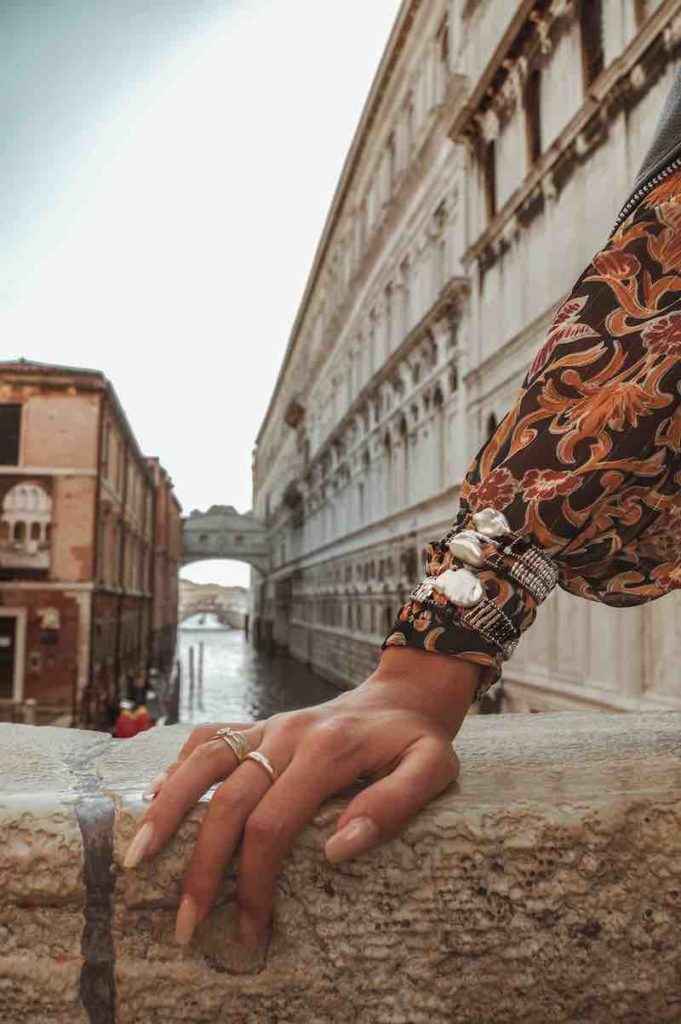 Model wearing Ziio Bracelet Baroque on Venice Bridge with Ziio Jewels