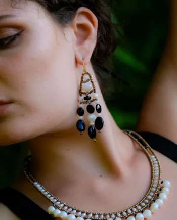Model wearing black and white DANCE Pearl Large earrings by Ziio