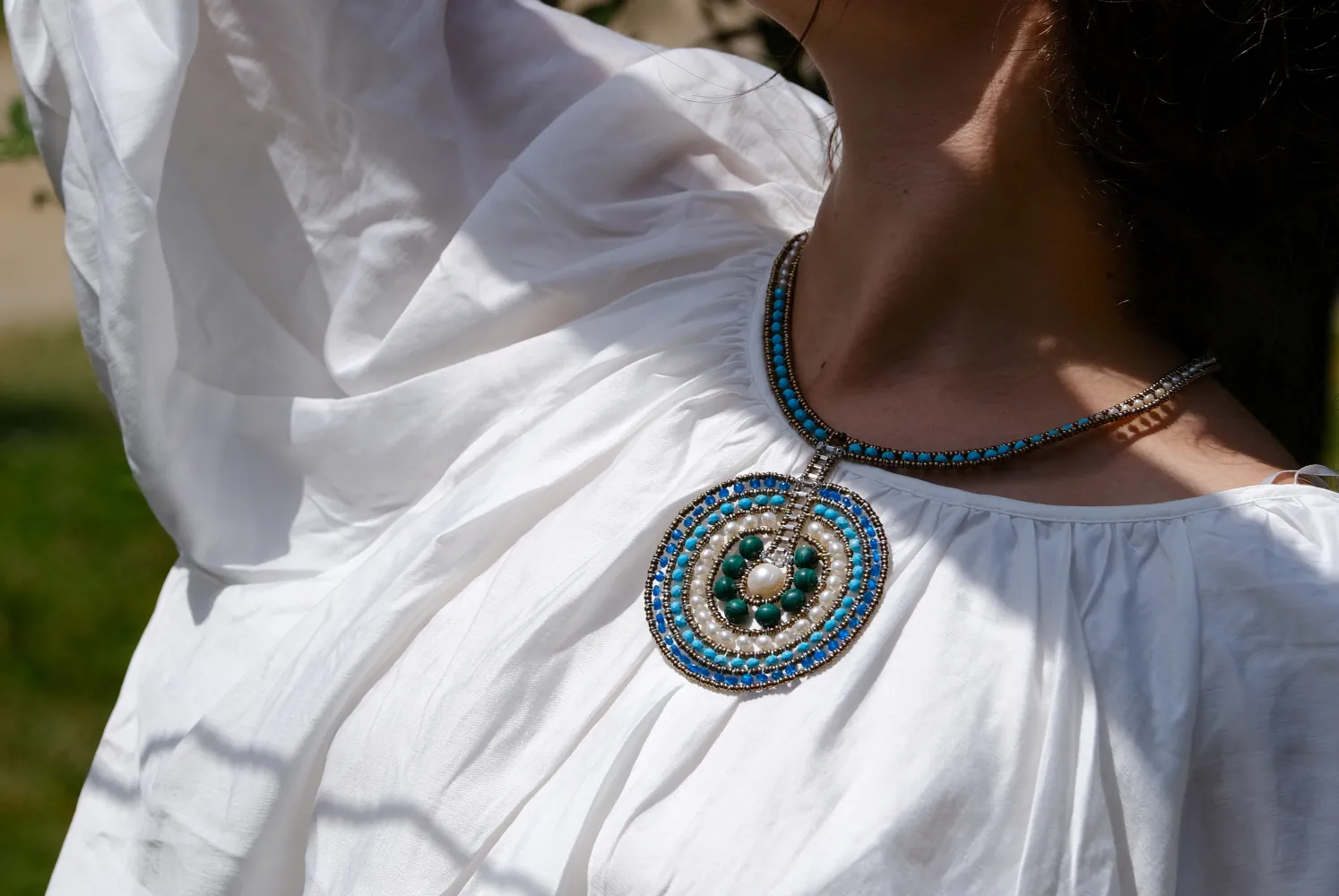 VENUS Blu necklace by Ziio worn with a white blouse